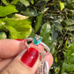 Anel Com Cristal Oval Central Laterais Zircônias Prata925